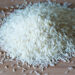 TORONTO, ONTARIO, CANADA - 2015/03/30: Small pile of long grain white rice over a wooden surface with natural illumination showing highlights and shadows, basmati rice in cutting board. (Photo by Roberto Machado Noa/LightRocket via Getty Images)